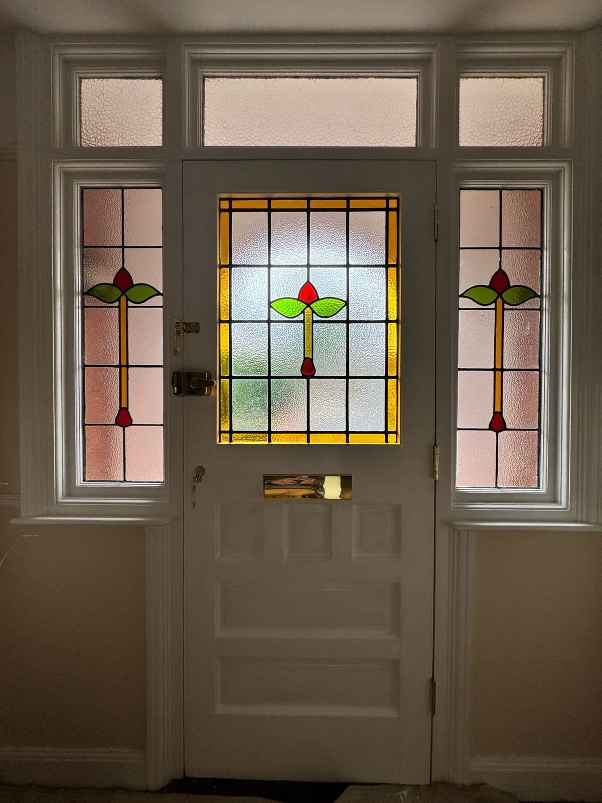 Decorative stained glass in a bespoke period front door and sidelights