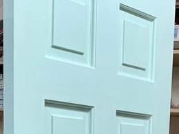 Raised and fielded panels on a six-panel door in the workshop