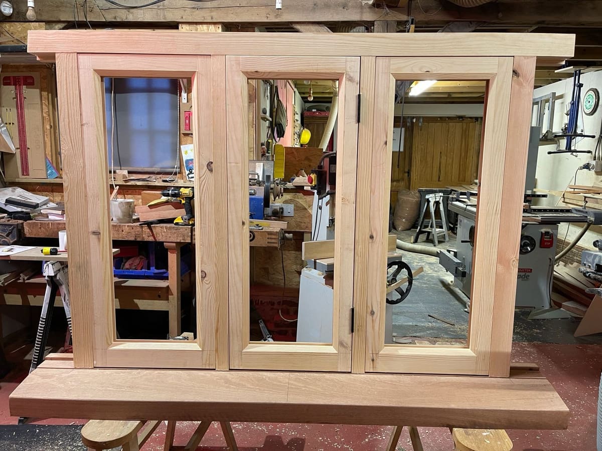 Three-light timber casement window and sill assembled on trestles in the Foxthorne workshop