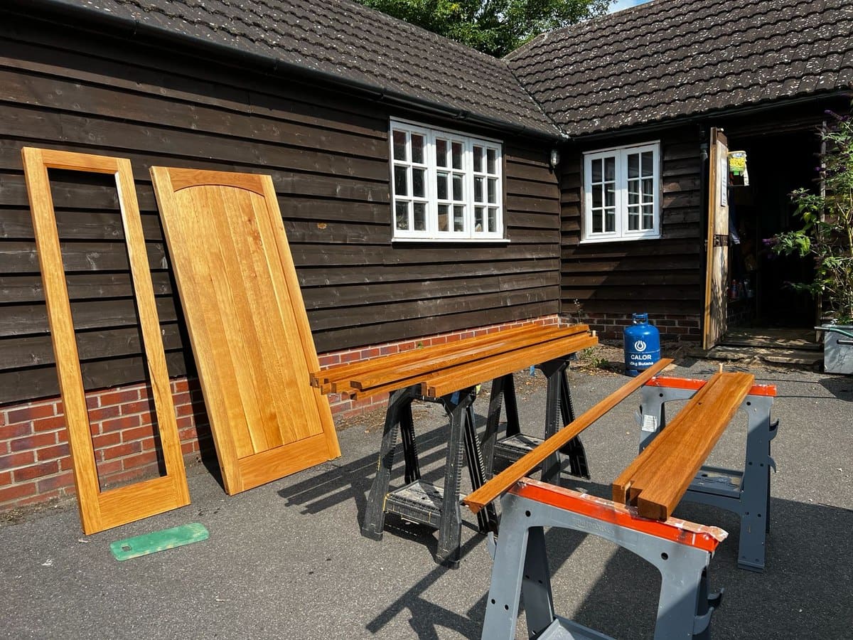Finished timber door components prepared before installation